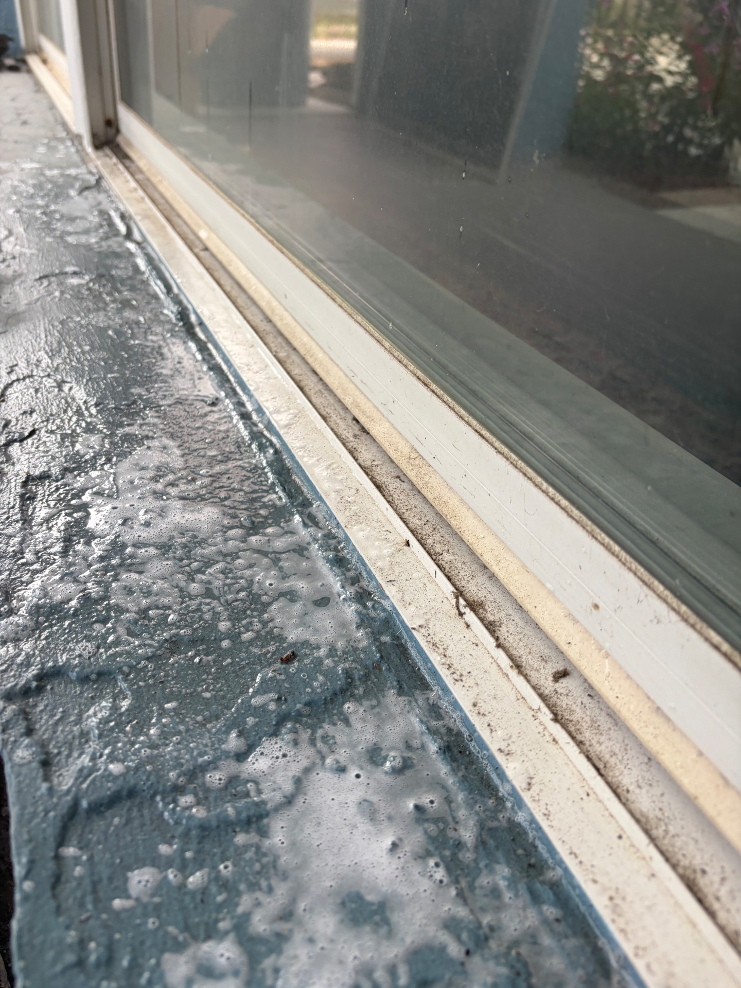 Before: long window sill and track with heavy buildup in Navarre