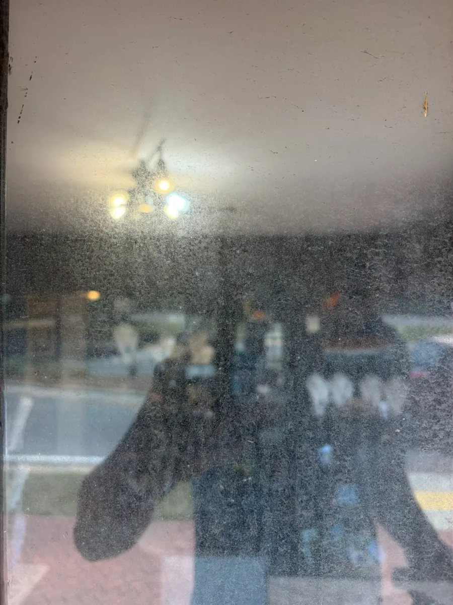 Before: hazy, salt-filmed glass on a real WAHOO! window cleaning job